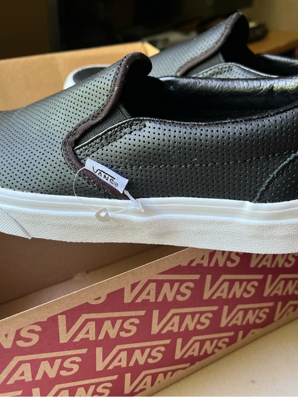 Vans Black Slip-On Perforated Canvas Sneakers with White Sole